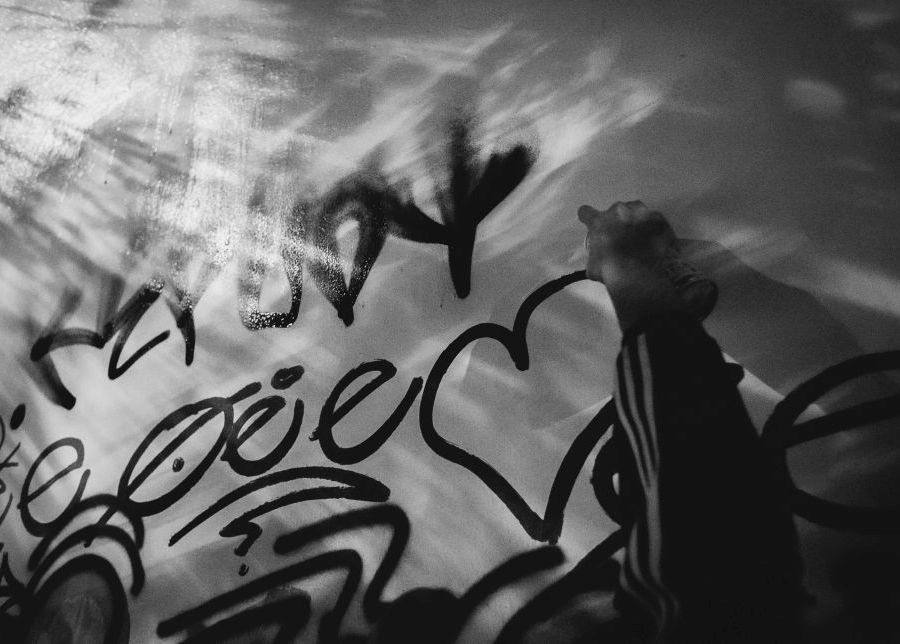 a guy is spraying a heart <3