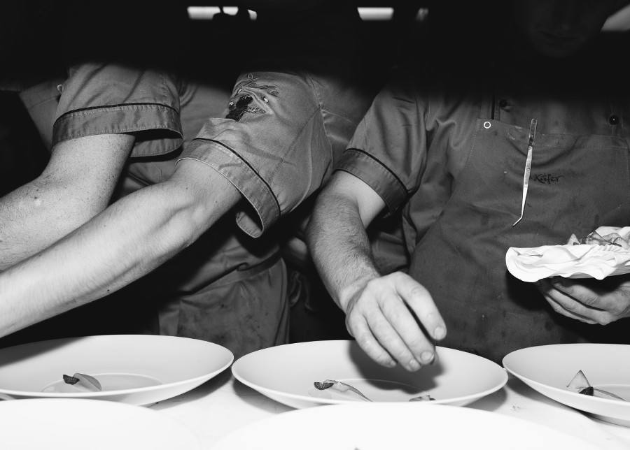 three chefs prepare the food