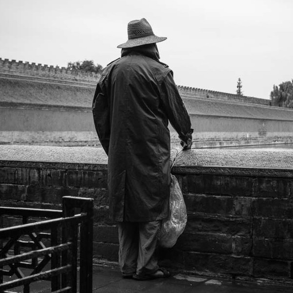 old man wearing a coat