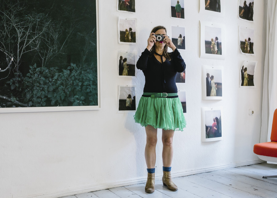 a woman makes a photo while she is photographed