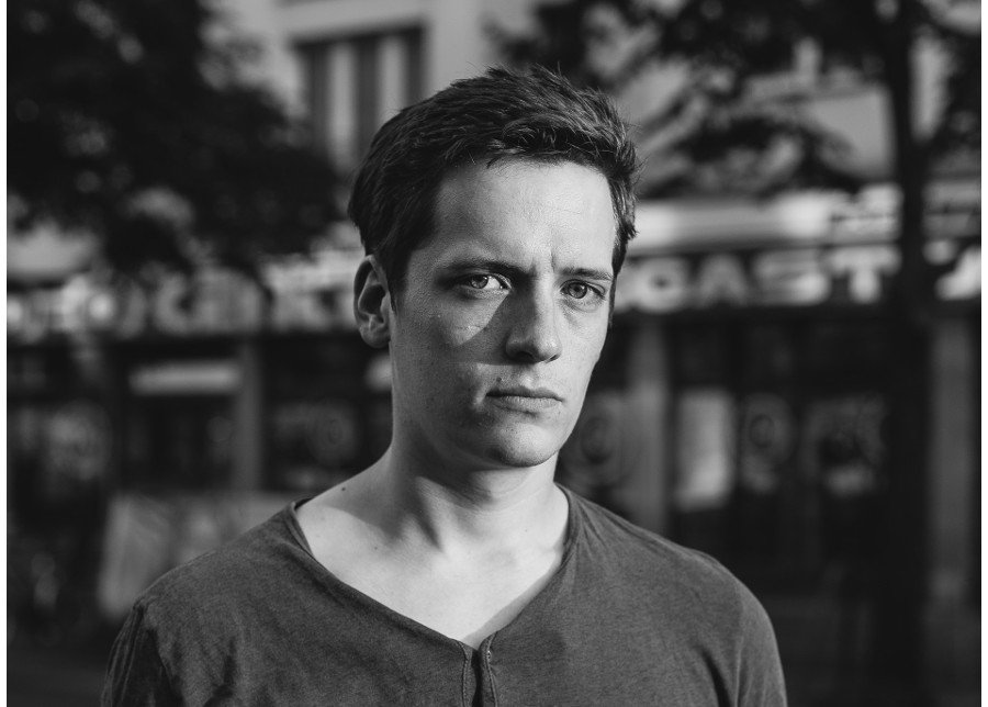 portrait of a guy in front of a grocery store